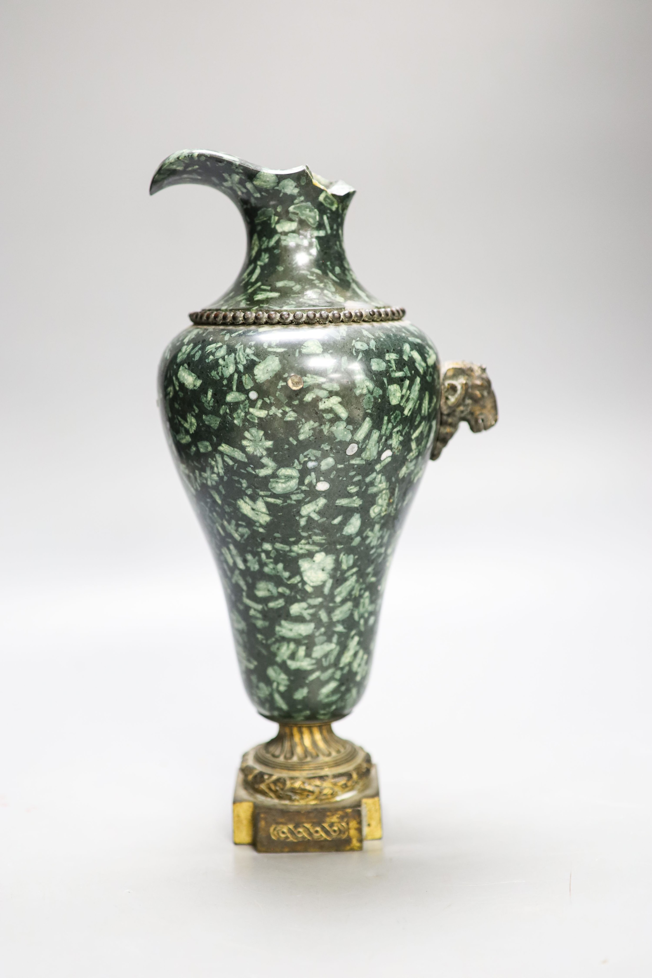 An ormolu mounted green fossil marble ewer, (a.f.) 29cm